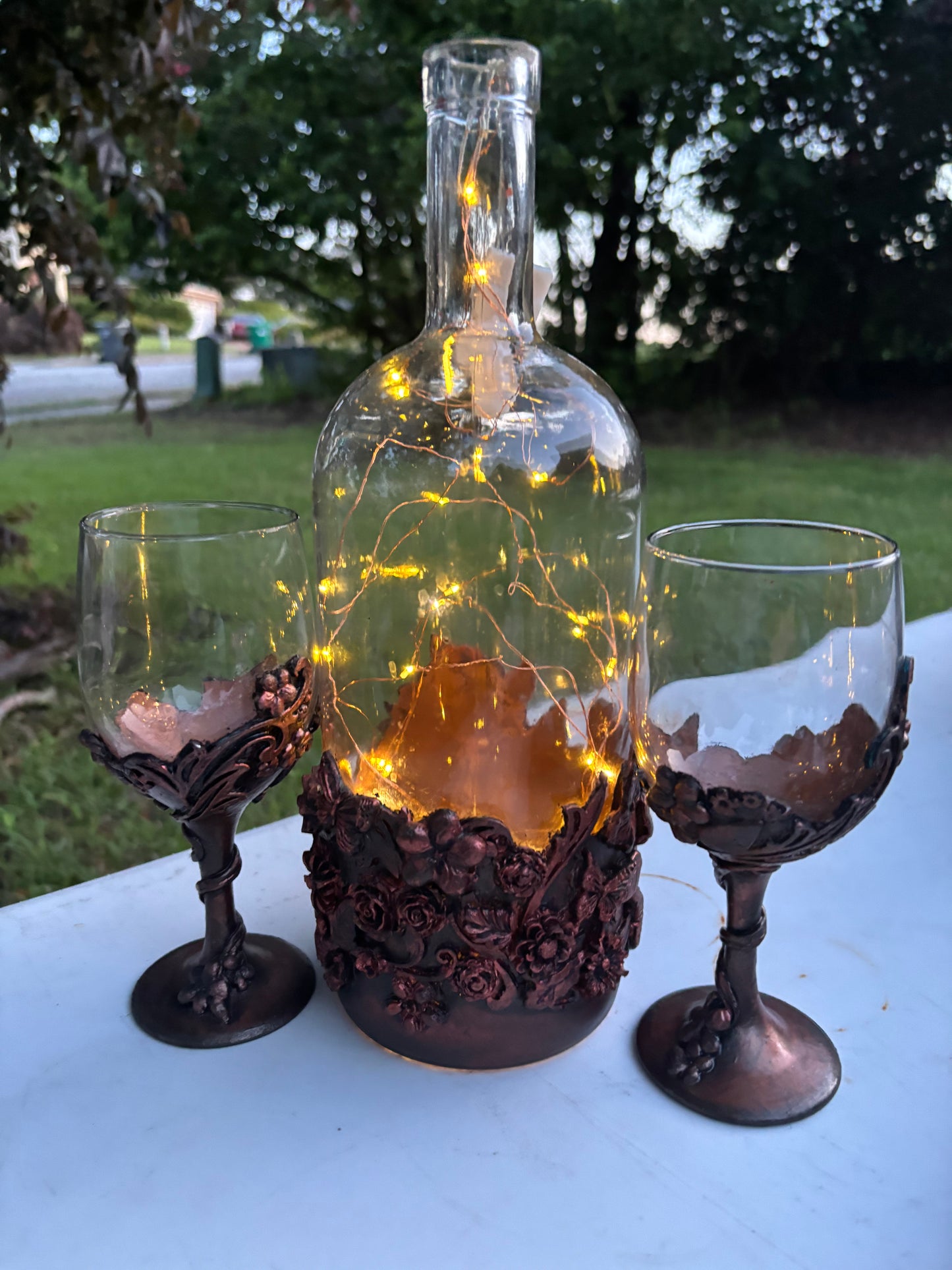 Wine bottle and glasses.  Aged metallic effect.  Copper look