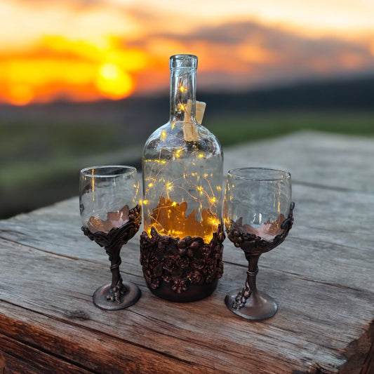 Wine bottle and glasses.  Aged metallic effect.  Copper look